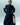 Navy fluid midi dress with waist tie, side slit, and studded bracelet-style cuffs