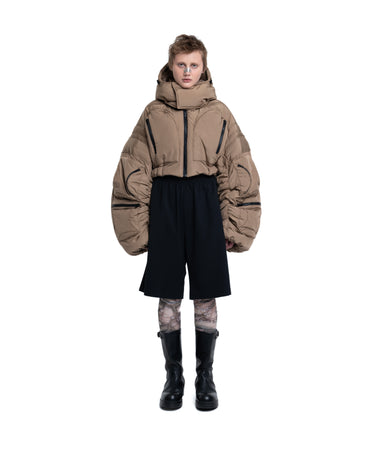 Cropped puffer jacket with hood, taupe sleeves and navy hem with drawstring