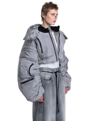 Gray cropped puffer jacket with hood and zip-front, left side detail