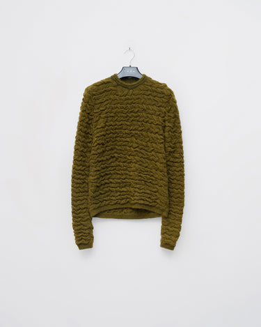 Olive green cable-knit sweater with crew neck and long sleeves