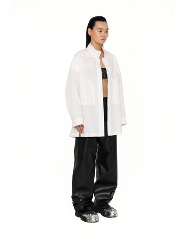 Milky white button-up shirt with stand collar and chest patch pockets, side view