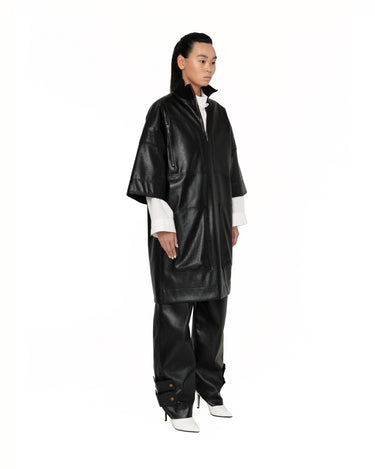 Dark short-sleeve anorak jacket with half-zip front and flap pocket details