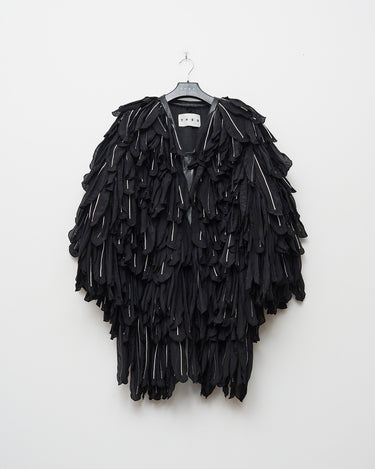 CORVUS wing coat on hanger, black textured layered design with high collar and buttonless front