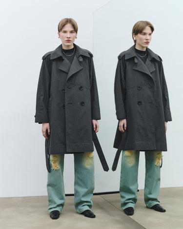 Textured trench coat, front view, double-breasted buttons, belted waist, long sleeves