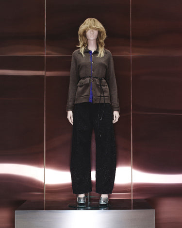 Dark gray cardigan with blue button placket, ribbed hem and cuffs, worn with dark pants