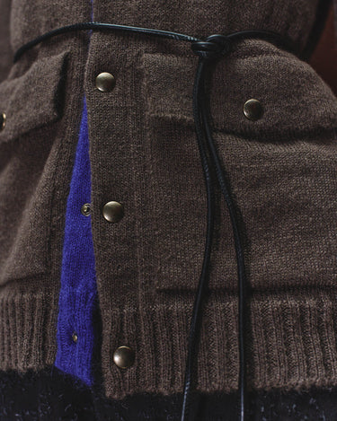 Dark gray cardigan hooded-style yoke detail with blue underlayer and metal snaps