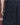 Dark navy denim jeans close-up of front panel with flap pockets and contrast orange stitching