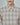 Beige plaid dress shirt collar with white buttons and front placket