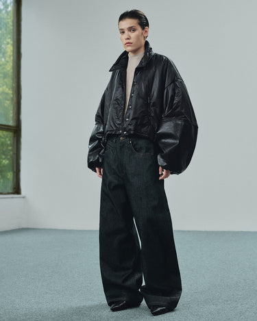 Front view of the cropped black puffer jacket with oversized sleeves and a high collar