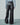 Black wide-leg faux leather pants with belt loops and double snap cuff tabs