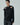 Black shirt with petal ruffle shoulders, button front, pointed collar and long sleeves