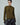 Olive green cable-knit sweater with long sleeves and ribbed hem