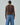 Brown cable-knit sweater back view with long sleeves and ribbed hem