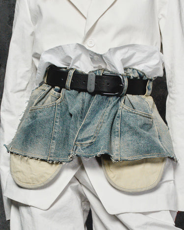 White apron with denim-look blue short overlay and black belt, frayed hem
