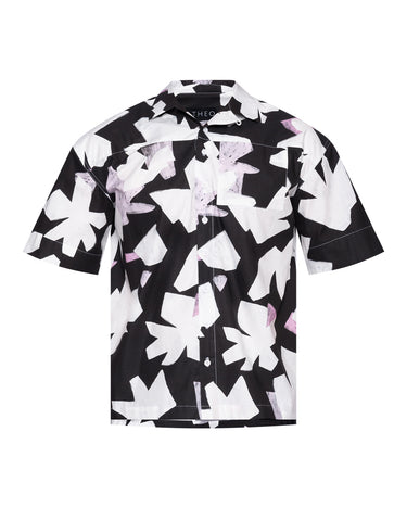 Black-and-white printed camp shirt close-up of button placket and fold collar.