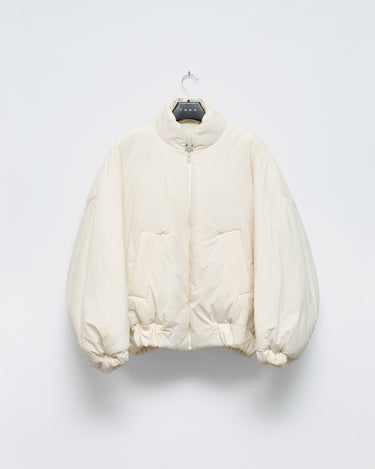 Cream padded bomber jacket with stand collar, front zipper, and two side pockets
