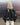 Black balloon jacket back view with gathered shoulders and voluminous sleeves