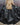Black balloon jacket back close-up with gathered hem and stitched panels