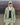 Light green hooded wind shell jacket with black zip front and drawcord hem