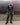 Men's black faux-leather trousers with front zip fly and straight legs