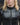 Men's black leather-look jacket detail: center zipper and stitched chest panels