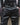 Men's black faux-leather trousers waistband with belt loops and silver buckles
