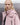 Pink hooded nylon jacket with snap shoulder tabs and front zipper, close-up