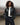 Black balloon jacket with front zip and elastic waistband at the hem
