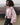 Pink hooded nylon jacket with front zipper and vertical pocket zips, side view