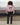Black leather-look ugly trousers shown from the back with belt loops