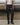 Black leather-look ugly trousers with belted waistband and pointed front creases