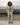 Light green wind shell jacket with hood, full-length black zipper, and relaxed fit