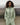 Light green hooded wind shell jacket with drawstring neckline and black zipper