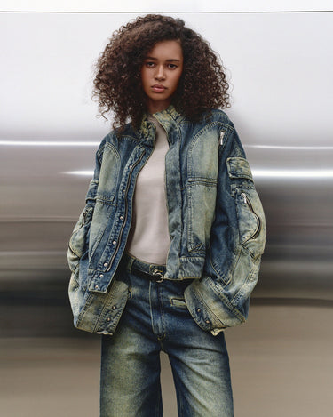 Faded blue hooded denim jacket with zip sleeve pockets and buttoned front