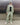 Light green track pants with elastic waistband and relaxed fit, cuffed hems