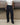 Black track pants with elastic waistband and relaxed legs, front view