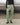 Light green track pants from the front, elastic waistband and ankle cuffs