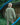 Light green cropped bomber jacket worn from behind, with elastic cuffs and zipper