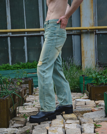 Light blue faded six-pocket jeans with wide straight legs