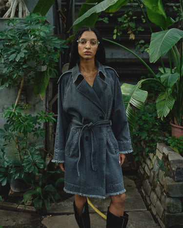 Gray denim belted trench coat with notched collar and buttoned cuffs