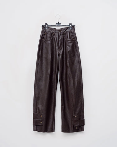 Dark brown loose-fit faux leather pants with wide legs and side seam pockets