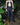 Navy six-pocket denim jeans on model, full-length straight leg view