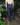 Navy six-pocket denim jeans on model, relaxed straight fit