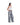 Distressed baggy jeans in light gray denim wash, side view with front drawstring tie