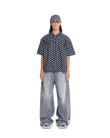 Black camp shirt with white dot print, camp collar, short sleeves, button front.