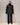 Elongated black jacket with stand collar, button front, and long sleeves