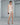 White lace slip dress with spaghetti straps and scalloped hem