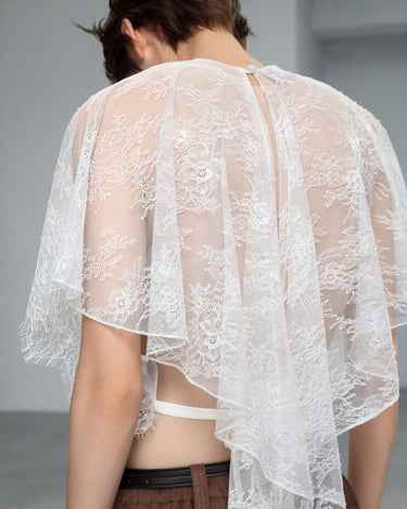 White sheer lace blouse back view with cape sleeves and keyhole detail