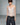 White lace camisole top with thin straps and scalloped V neckline