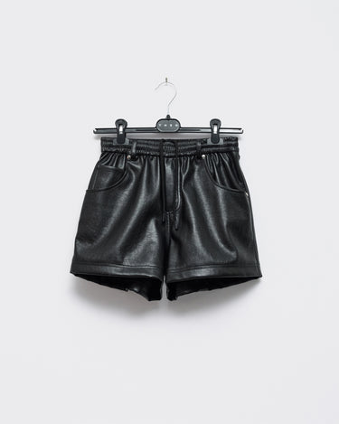 Black faux-leather mini shorts on a hanger with drawstring and pockets